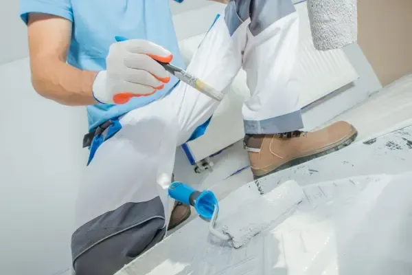 A man in Oahu painting with a brush.