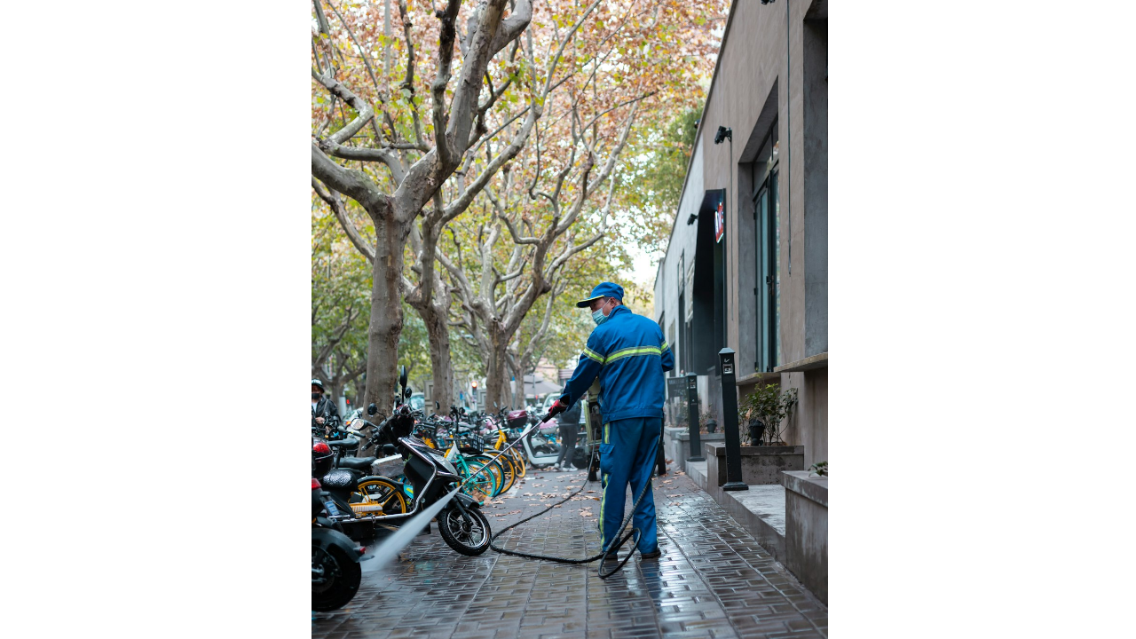 oahu power washing technician cleaning streets
