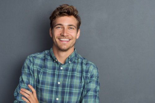 middle age man smiling, improve your smile with cosmetic dentistry blog