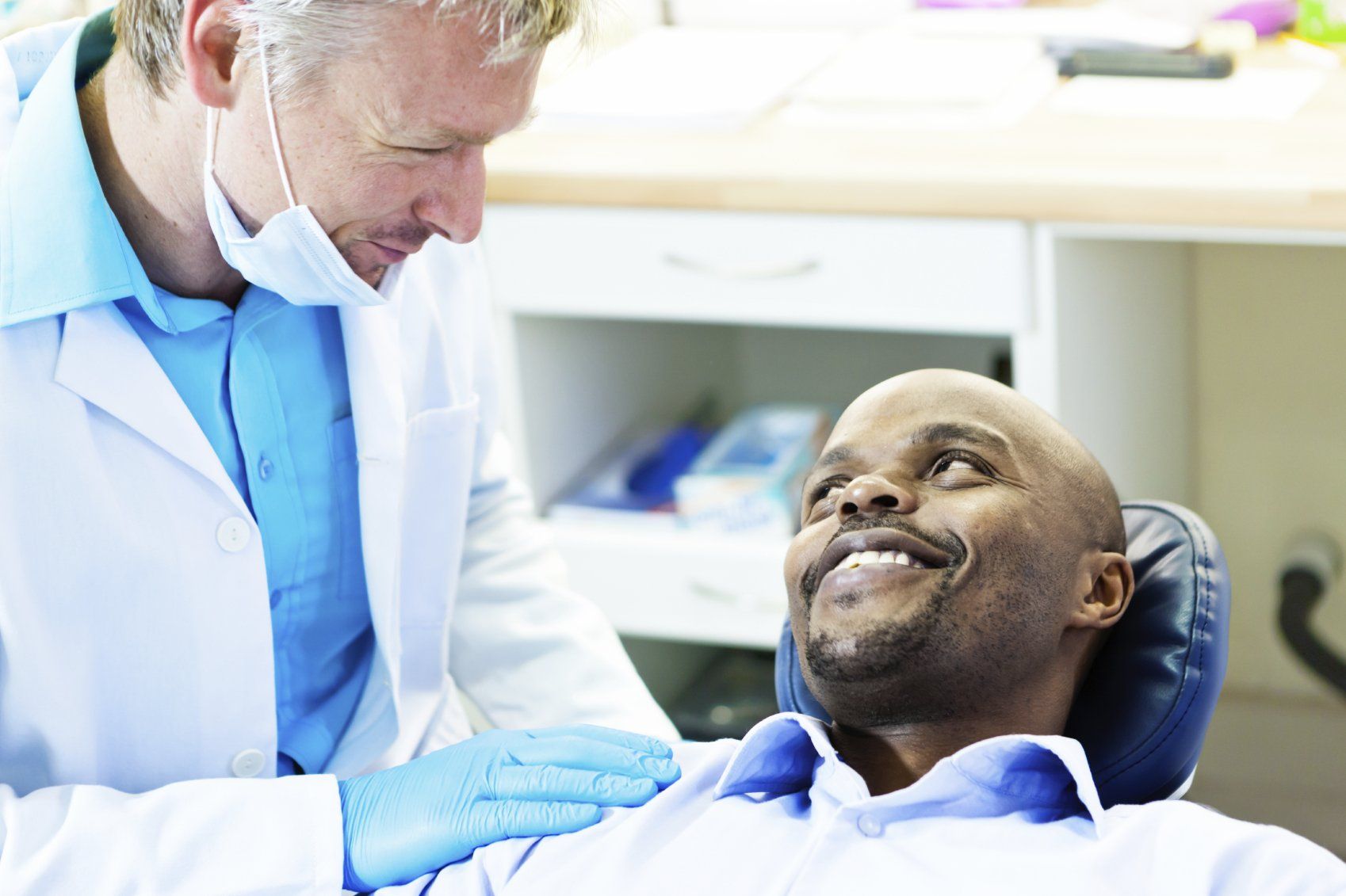 black man at the dentist, different types of dental crowns blog