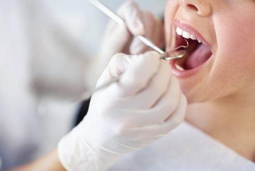 close up of dentist doing a dental check up - signs of gingivitis blog 2 