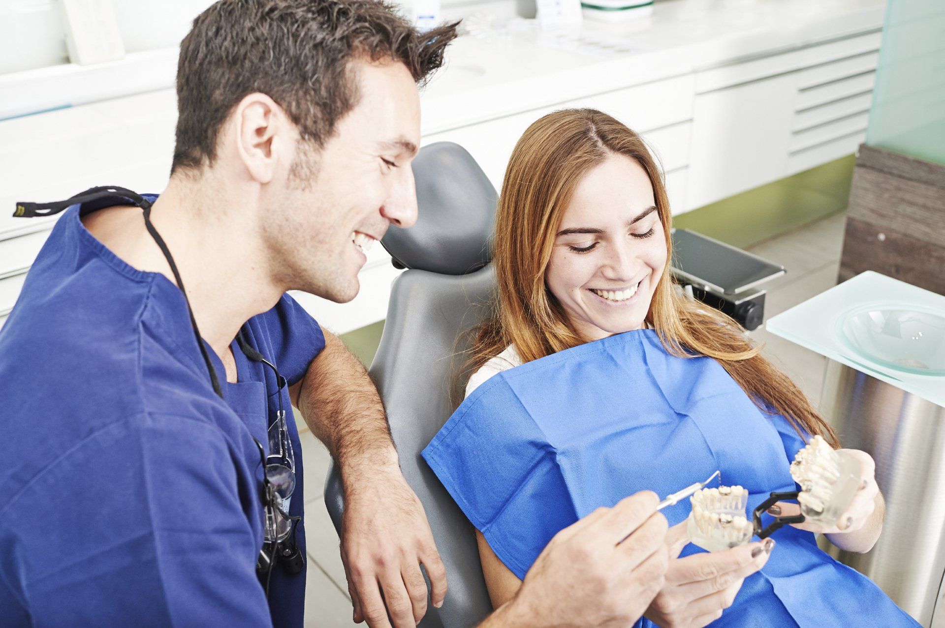 dentist with patient, dental crown procedure 101 blog