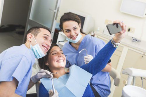 friendly dentist with patient - things your dentist wishes you knew blog