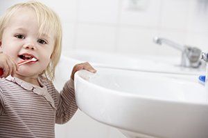 kid brushing teeth, baby's first toothbrush blog