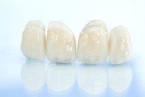 dental crowns lined up - why is a crown important after a root canal blog