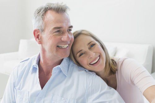 older couple smiling - dental bridge problems blog
