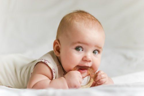 baby  chewing on baby toy, how to help teething babies blog