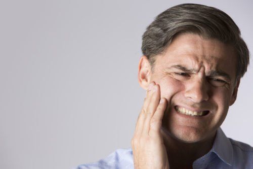 man with dental pain, what's causing my toothache blog