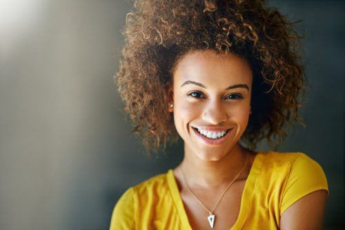 smiling woman, dental health resolutions blog