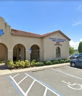 A building with a handicapped parking spot in front of it