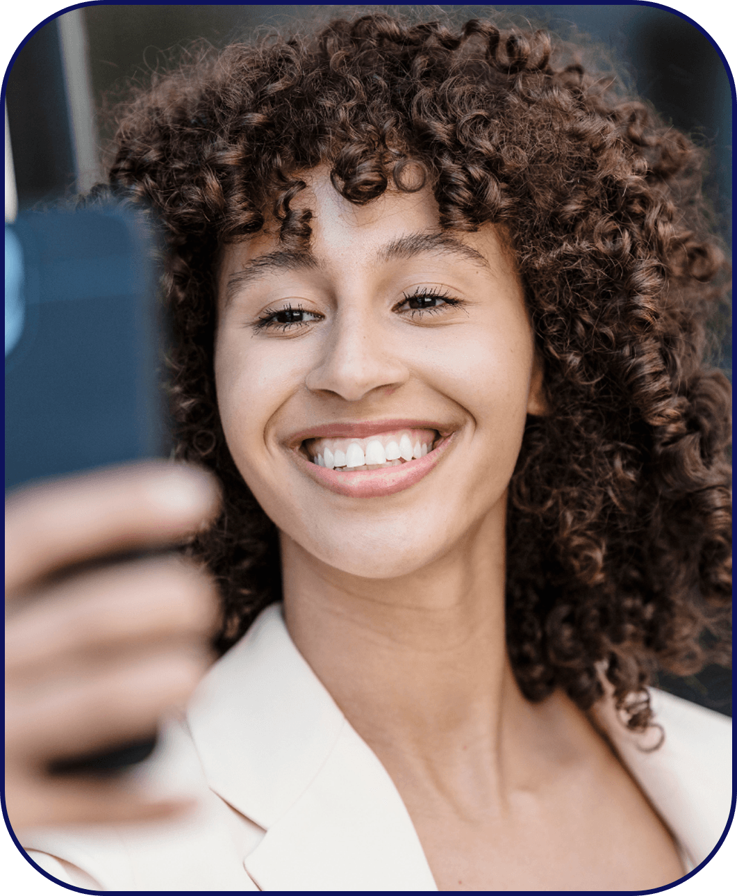 Confidently smiling woman taking a selfie