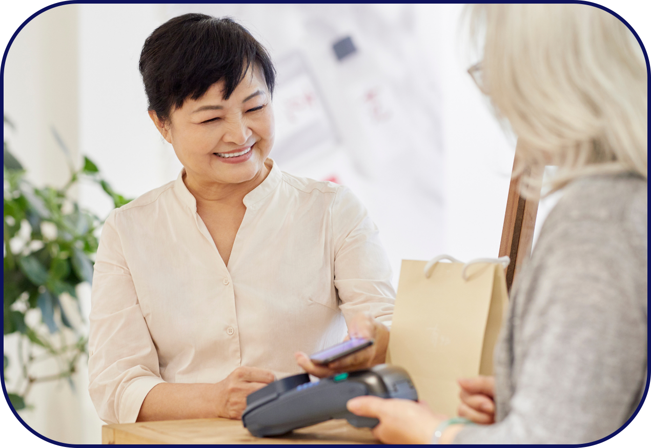 Woman happily paying with card