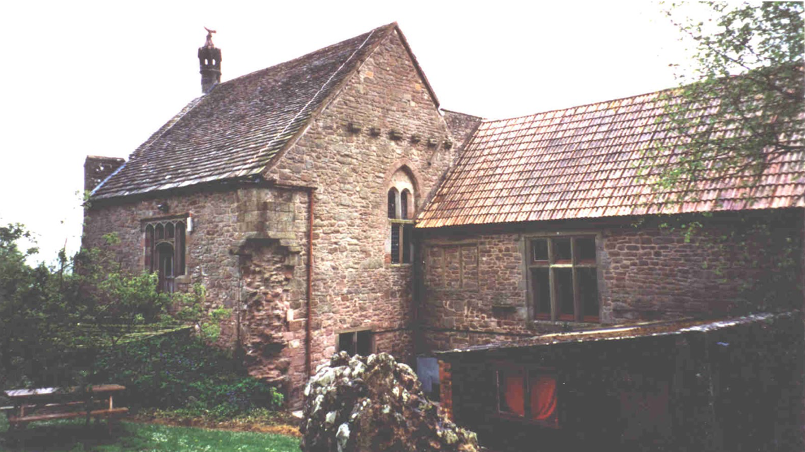 A large brick building with a tiled roof
