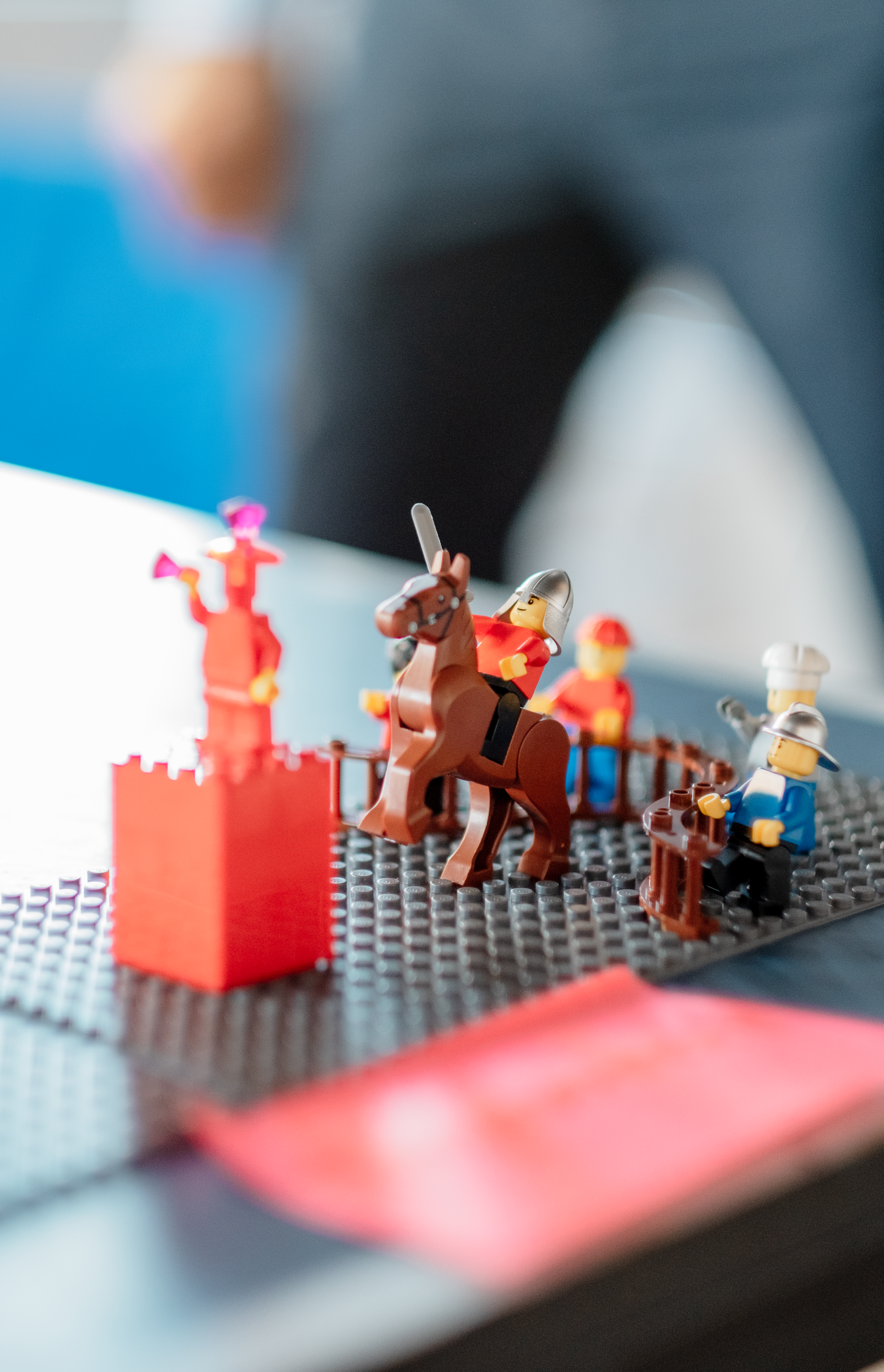 A group of lego figures are sitting on a table.