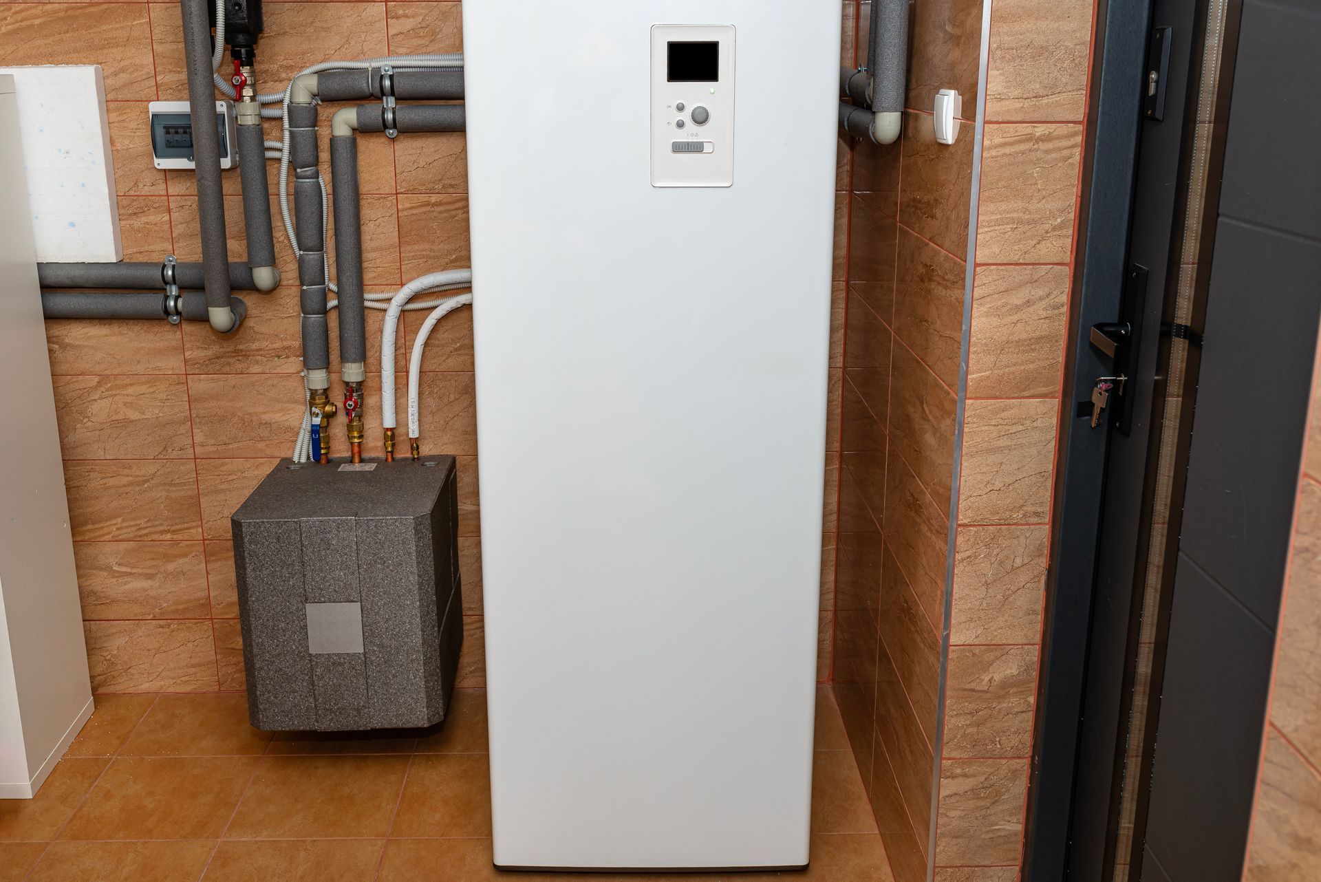 High-efficiency heat pump hot water system installed on a residential property.