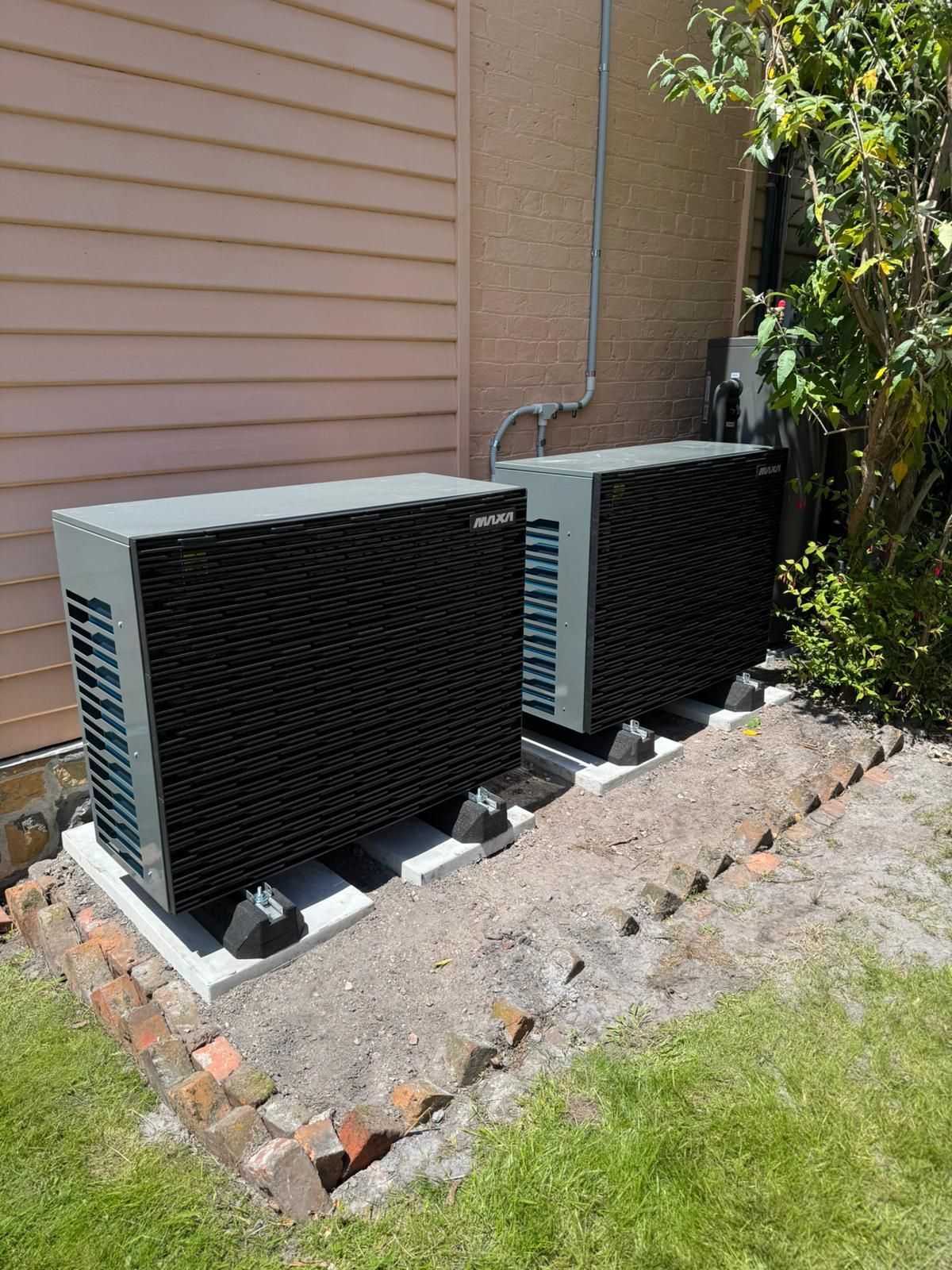 Hydronic heating and cooling system with fan coils in high end Warrnambool home powered by electric heat pump.