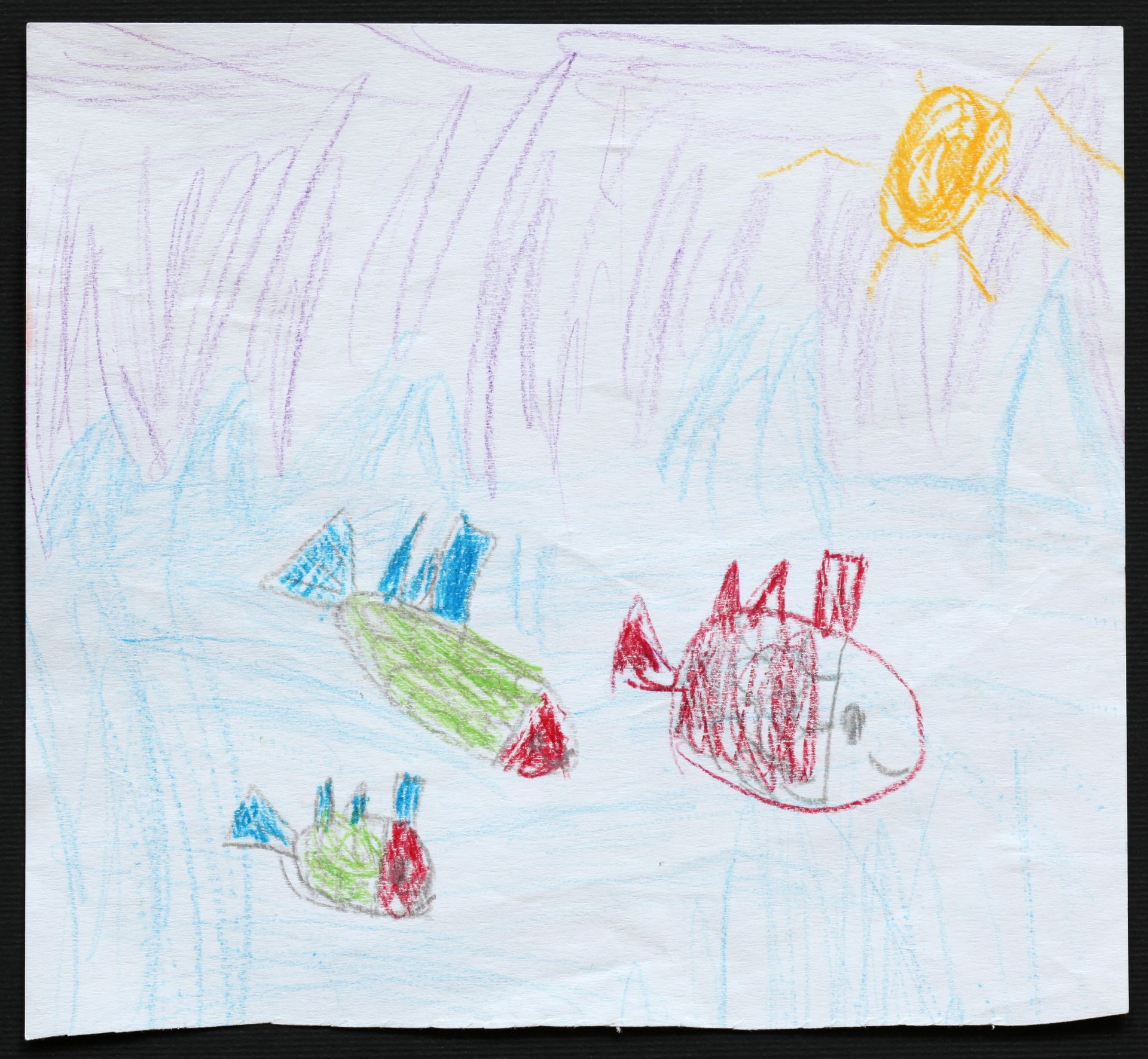 Children's drawing of fish under the sea