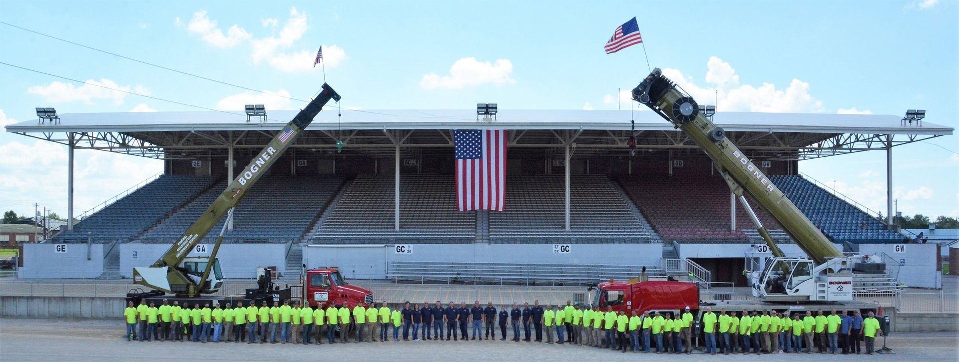 A Group of People Standing in Front of an American Flag | Wooster, OH | Bogner Construction Company
