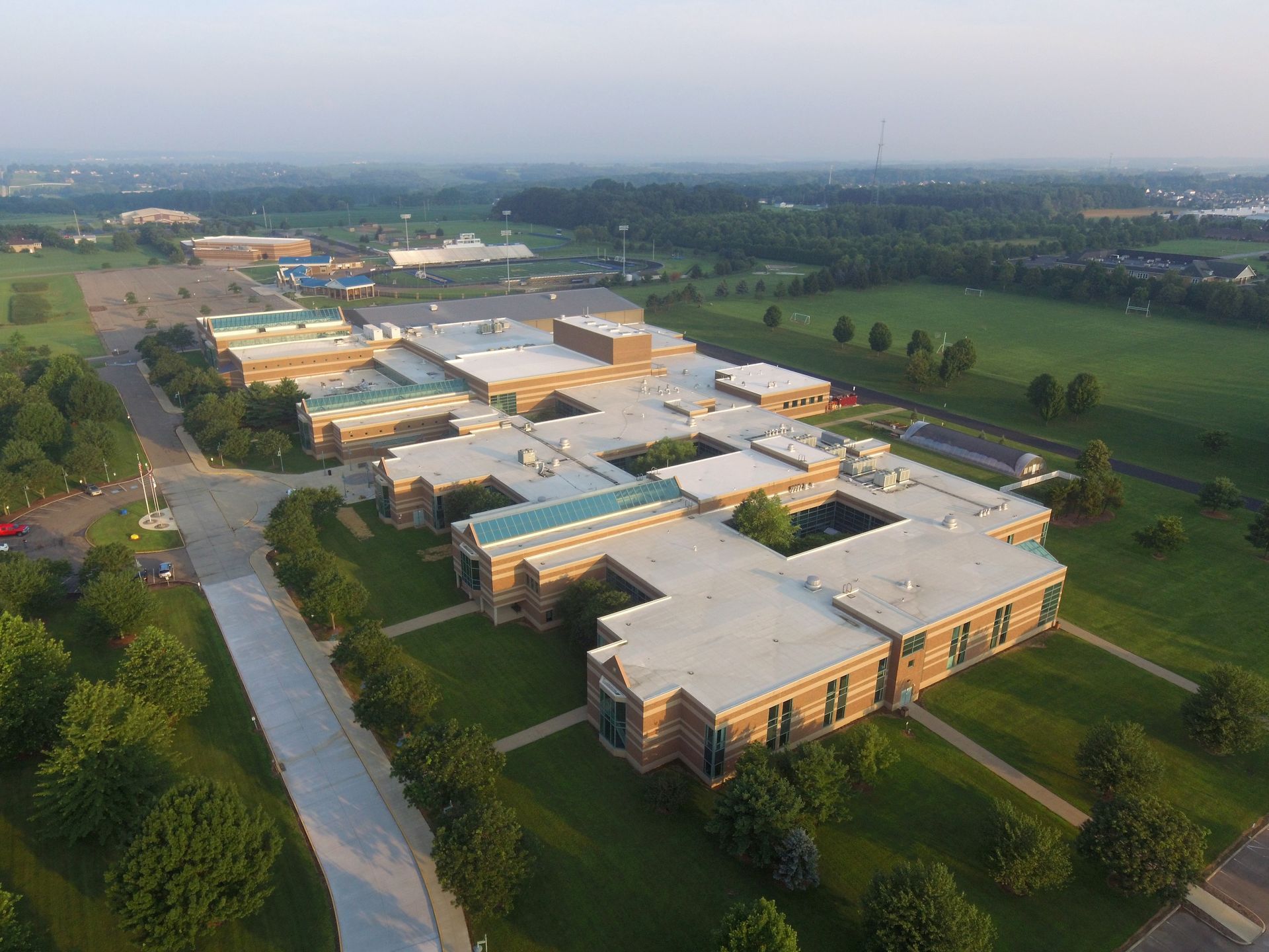 An Aerial View of a Large Building Surrounded by Trees and Grass | Wooster, OH | Bogner Construction Company