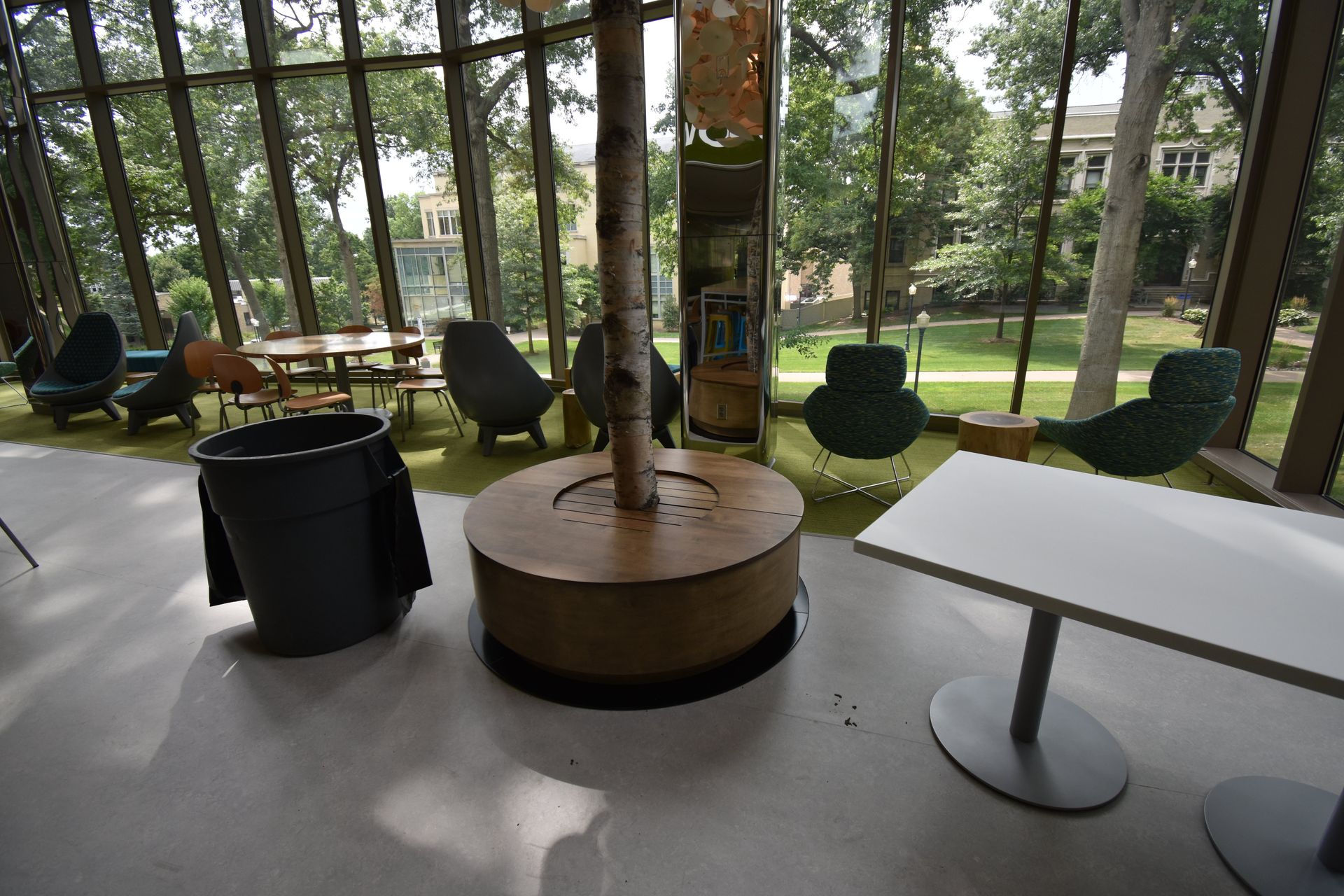 A Room with Tables Chairs and a Tree in the Middle | Wooster, OH | Bogner Construction Company