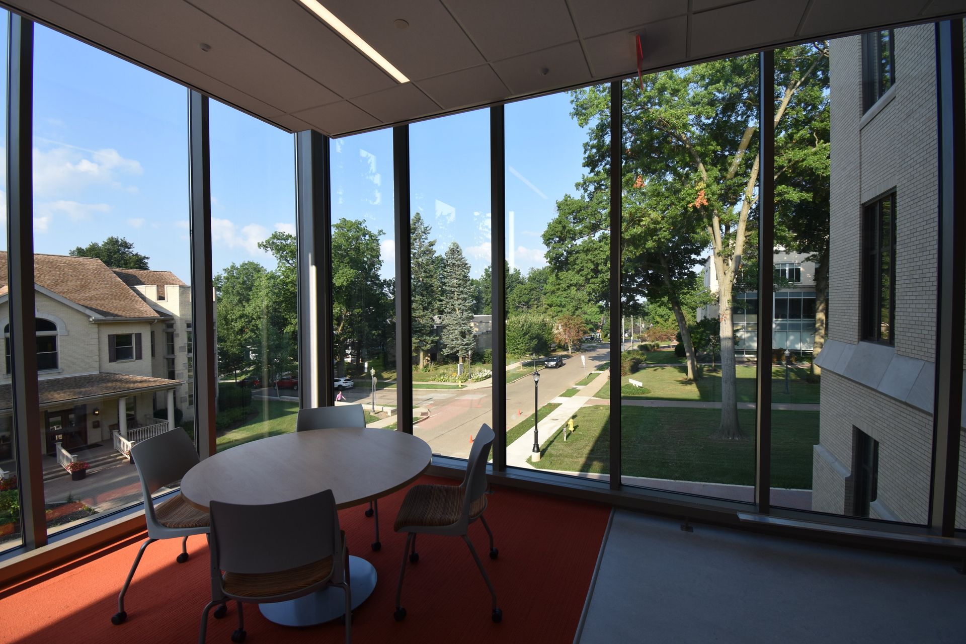 A Room with a Table and Chairs in Front of a Large Window | Wooster, OH | Bogner Construction Company