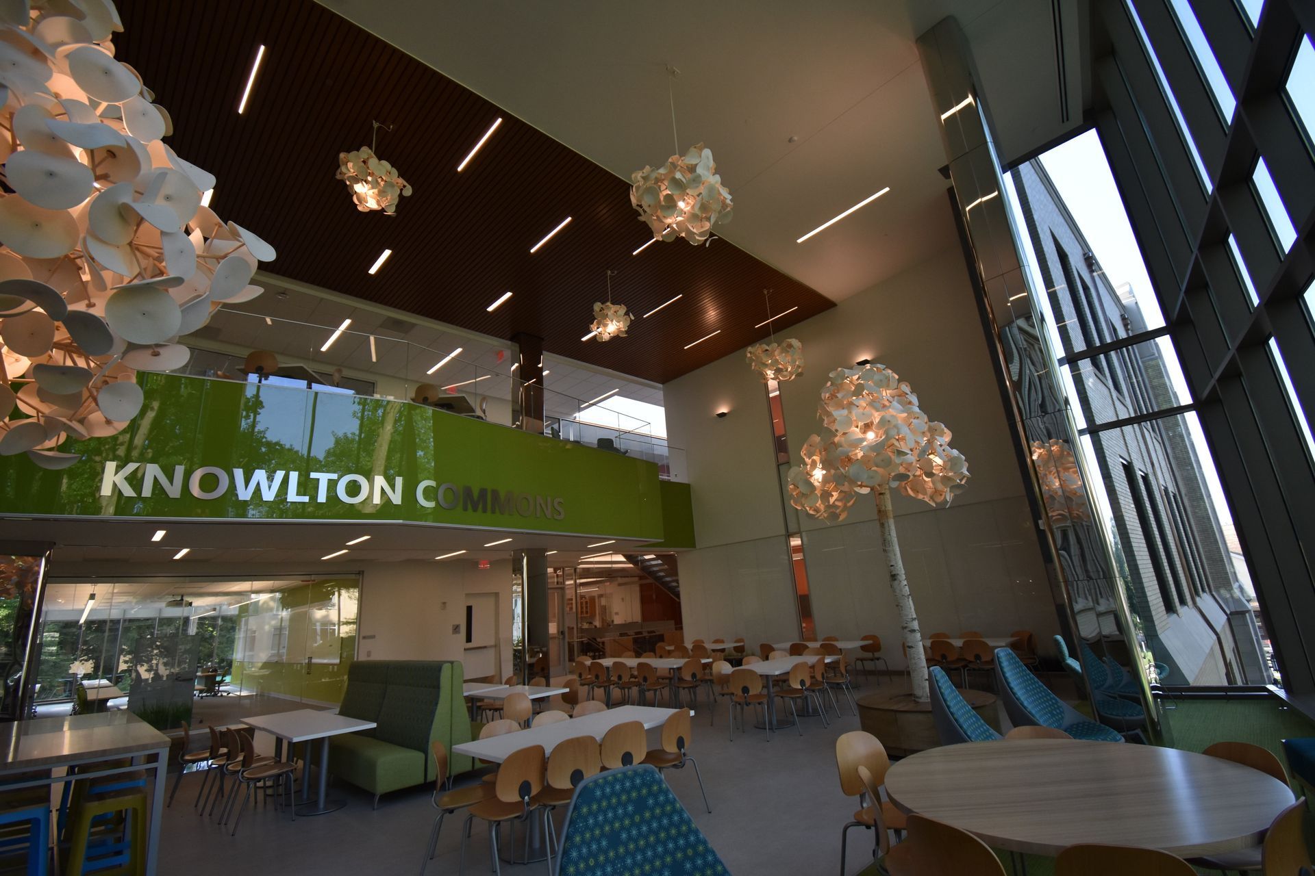 A Large Room with Tables and Chairs and a Sign that says Knowlton | Wooster, OH | Bogner Construction Company