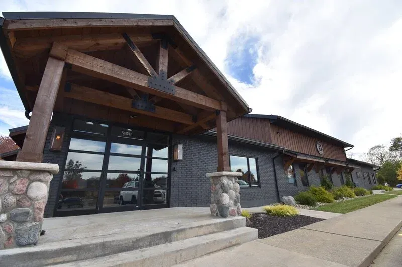 A Large Building with a Wooden Roof and Stairs Leading up to it | Wooster, OH | Bogner Construction Company