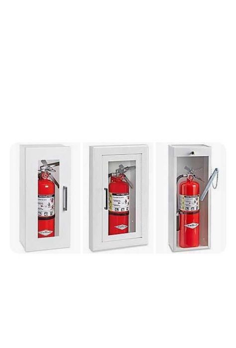 A fire extinguisher is sitting inside of a white cabinet.