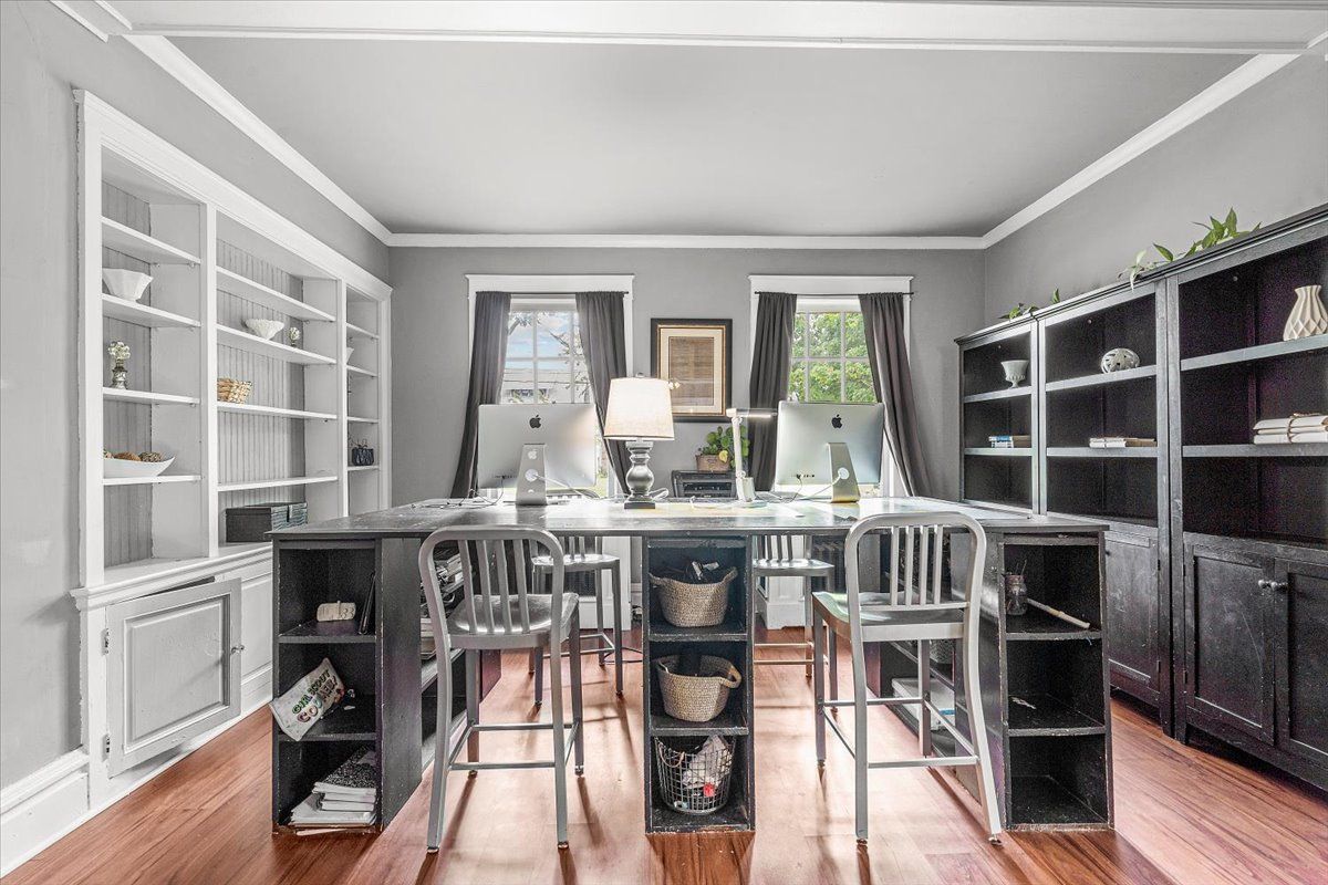 Home staging a cluttered home school space involved removing most books from the shelves. 