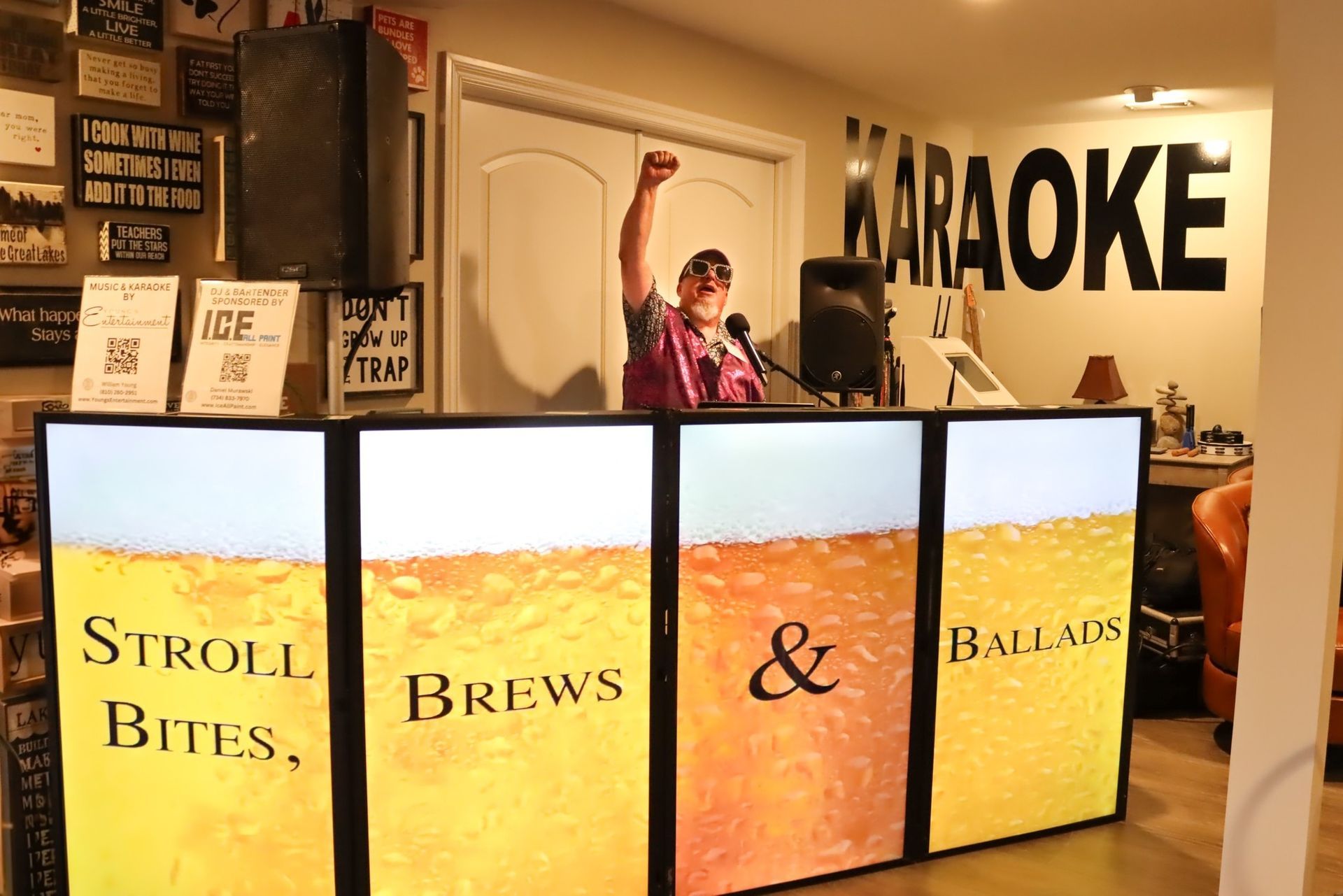 Person with raised fist at karaoke bar.