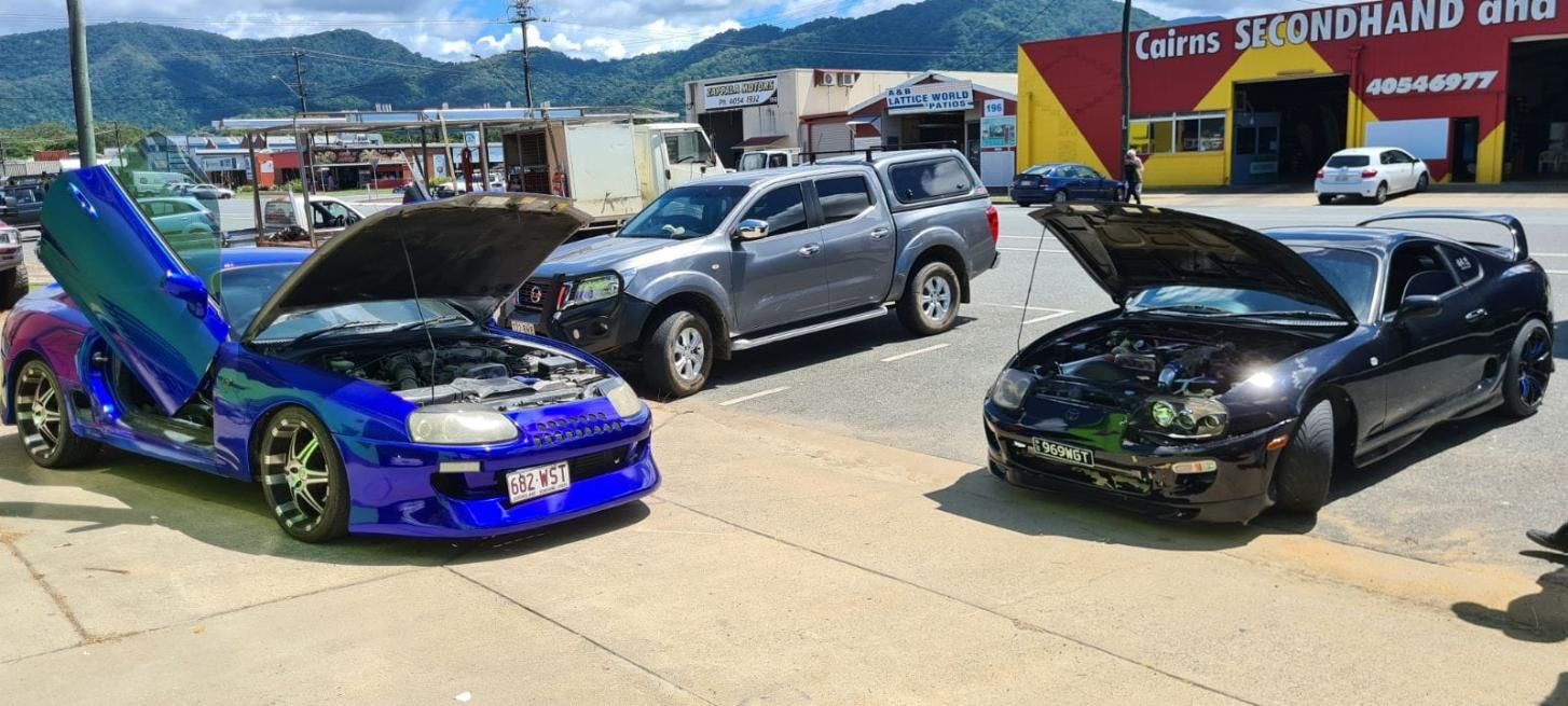 Two Cars Are Parked Next to Each Other in a Parking Lot With Their Hoods Open — Dentmaster Refinishing In Bungalow, QLD