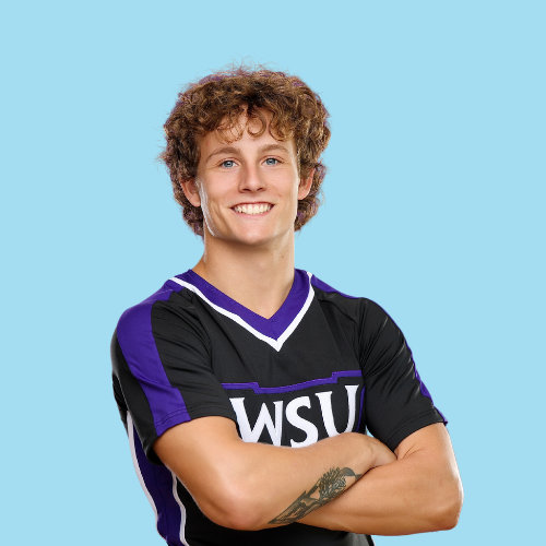 Smiling man in black and purple 