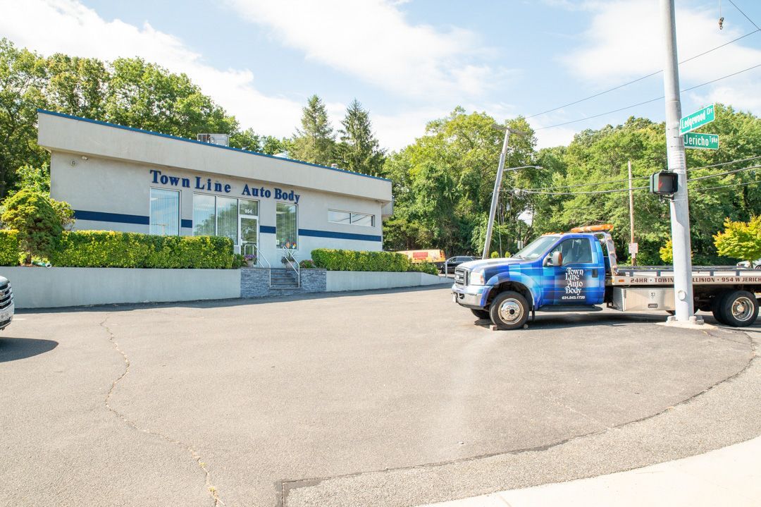 Exterior with our tow truck at Town Line Auto Body