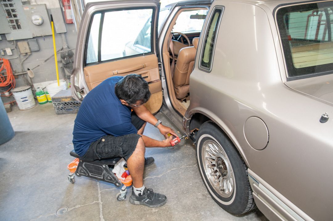 Working on a vehicle at Town Line Auto Body