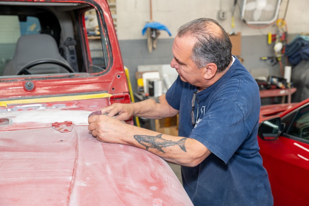 Working on a vehicle at Town Line Auto Body