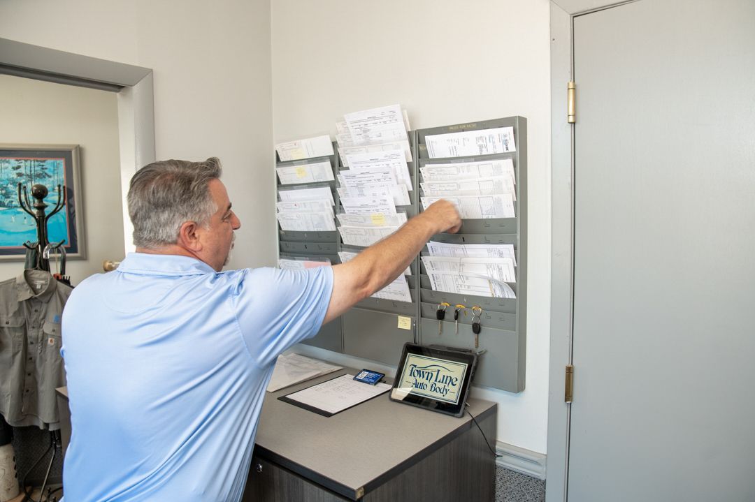 grabbing orders at Town Line Auto Body