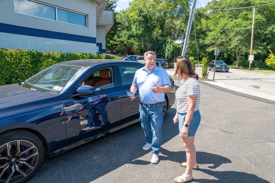 Speaking with a client at Town Line Auto Body