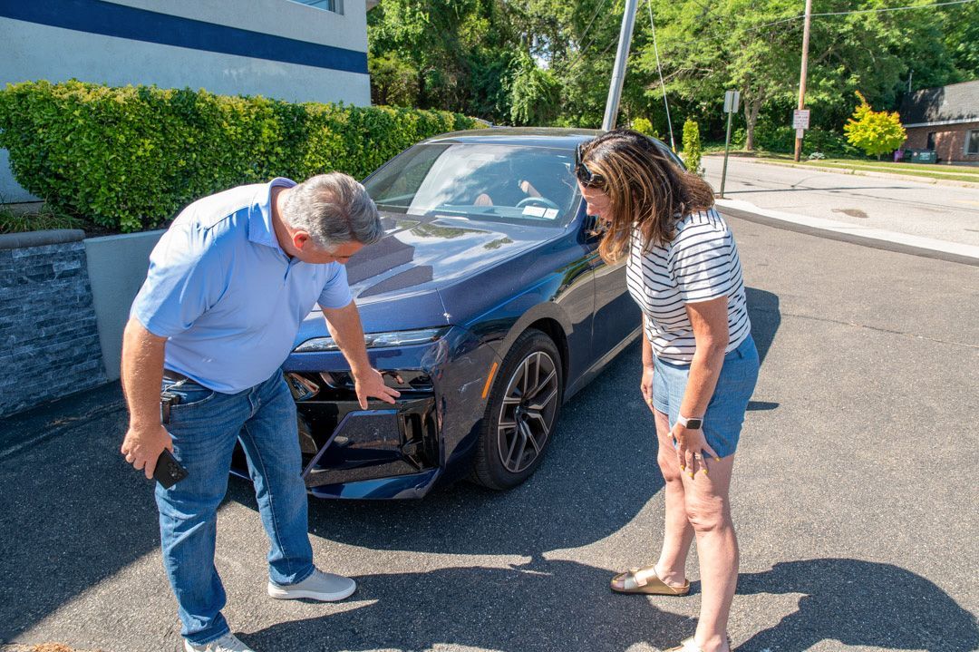 Showing a client some work at Town Line Auto Body