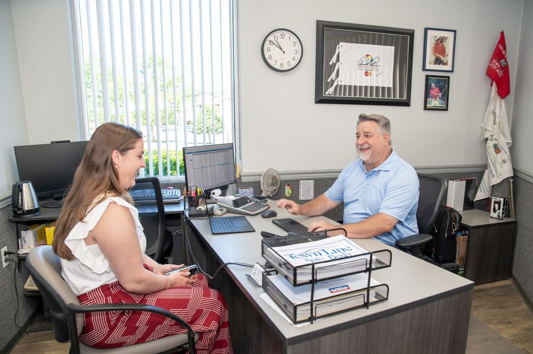 Working with a customer at Town Line Auto Body