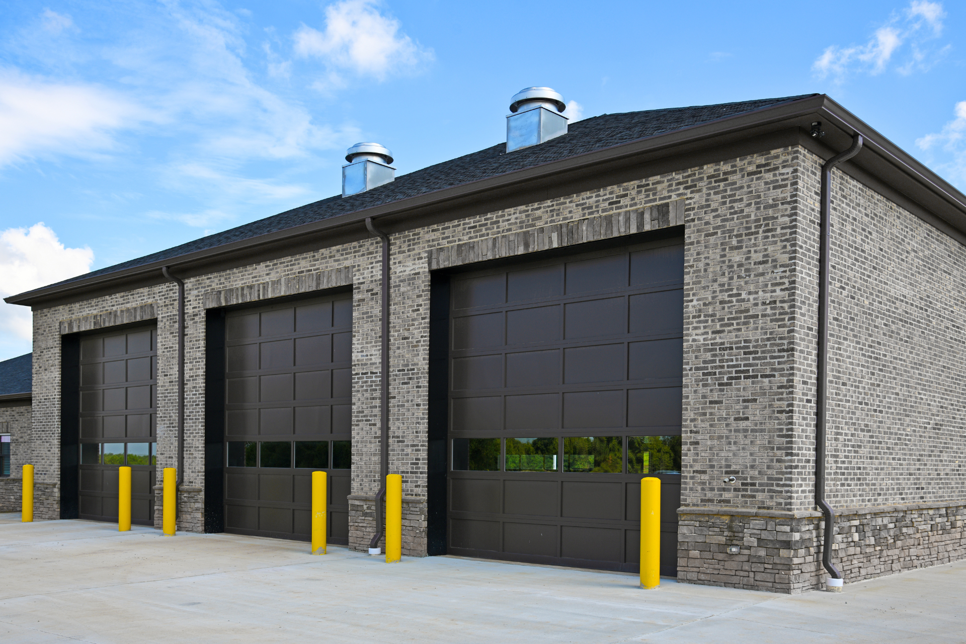 Brown wooden garage door with windows.