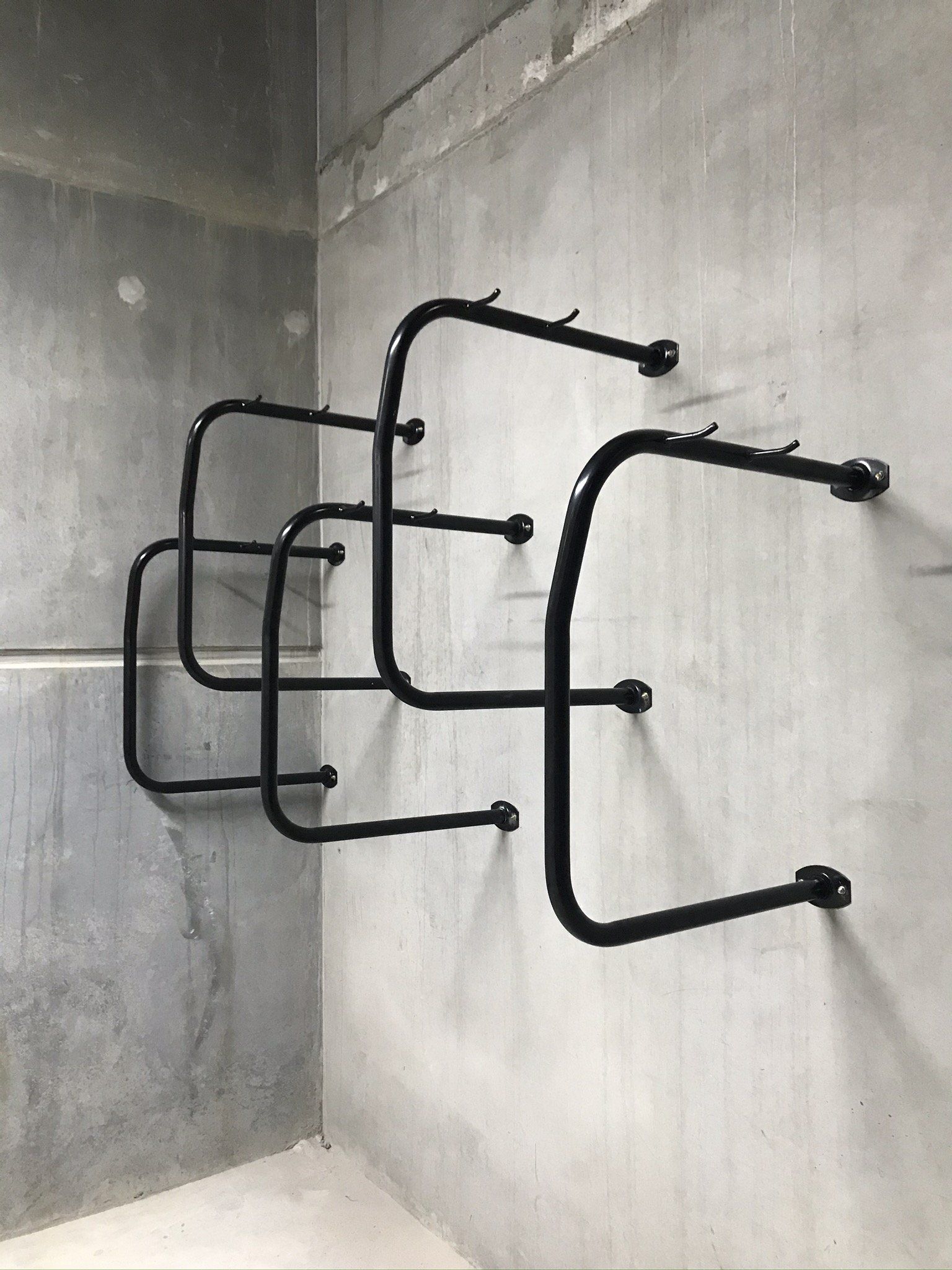 Hanging type bike racks mounted to a wall