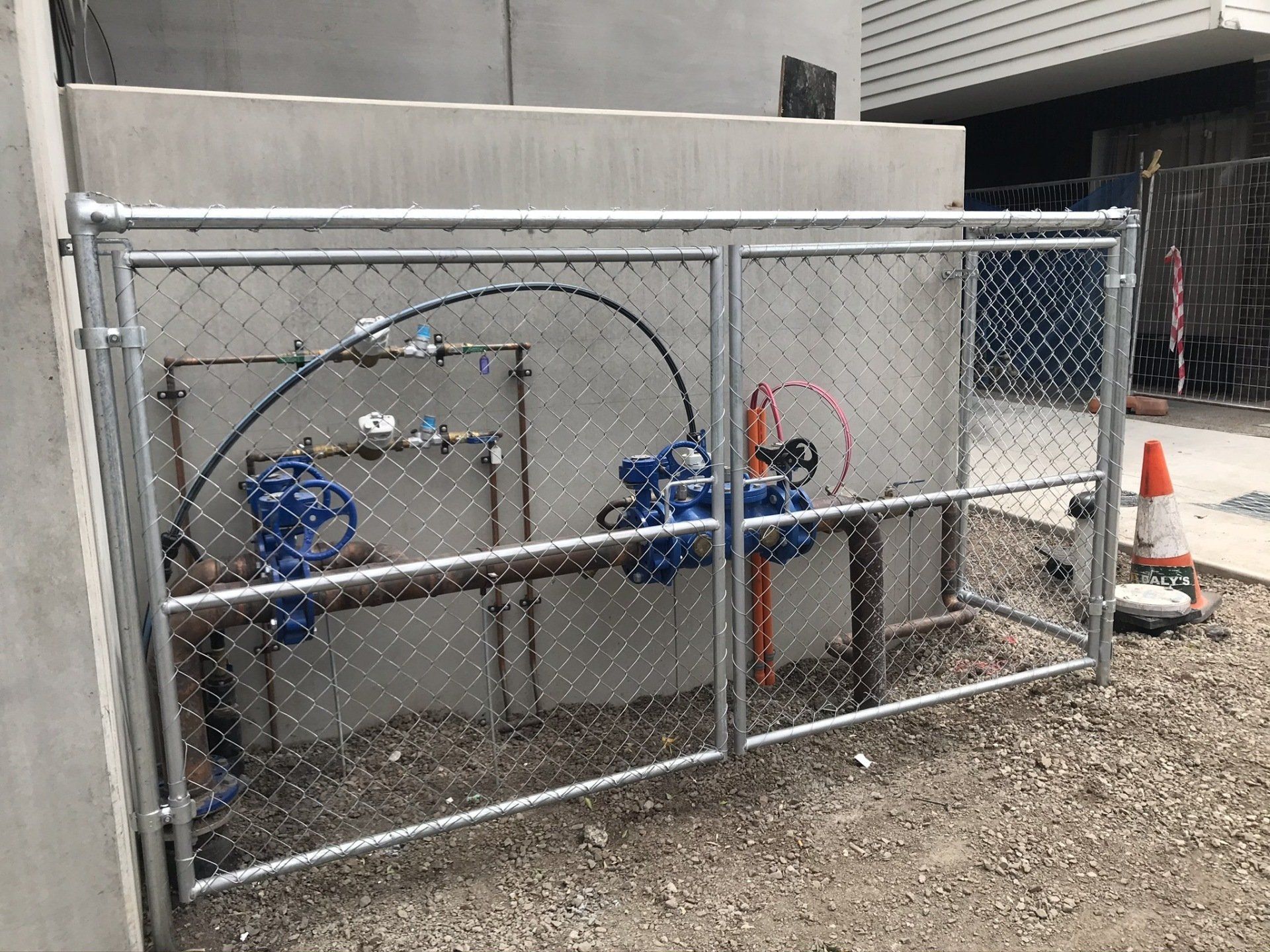 Chain mesh storage enclosure for a outdoor water meter