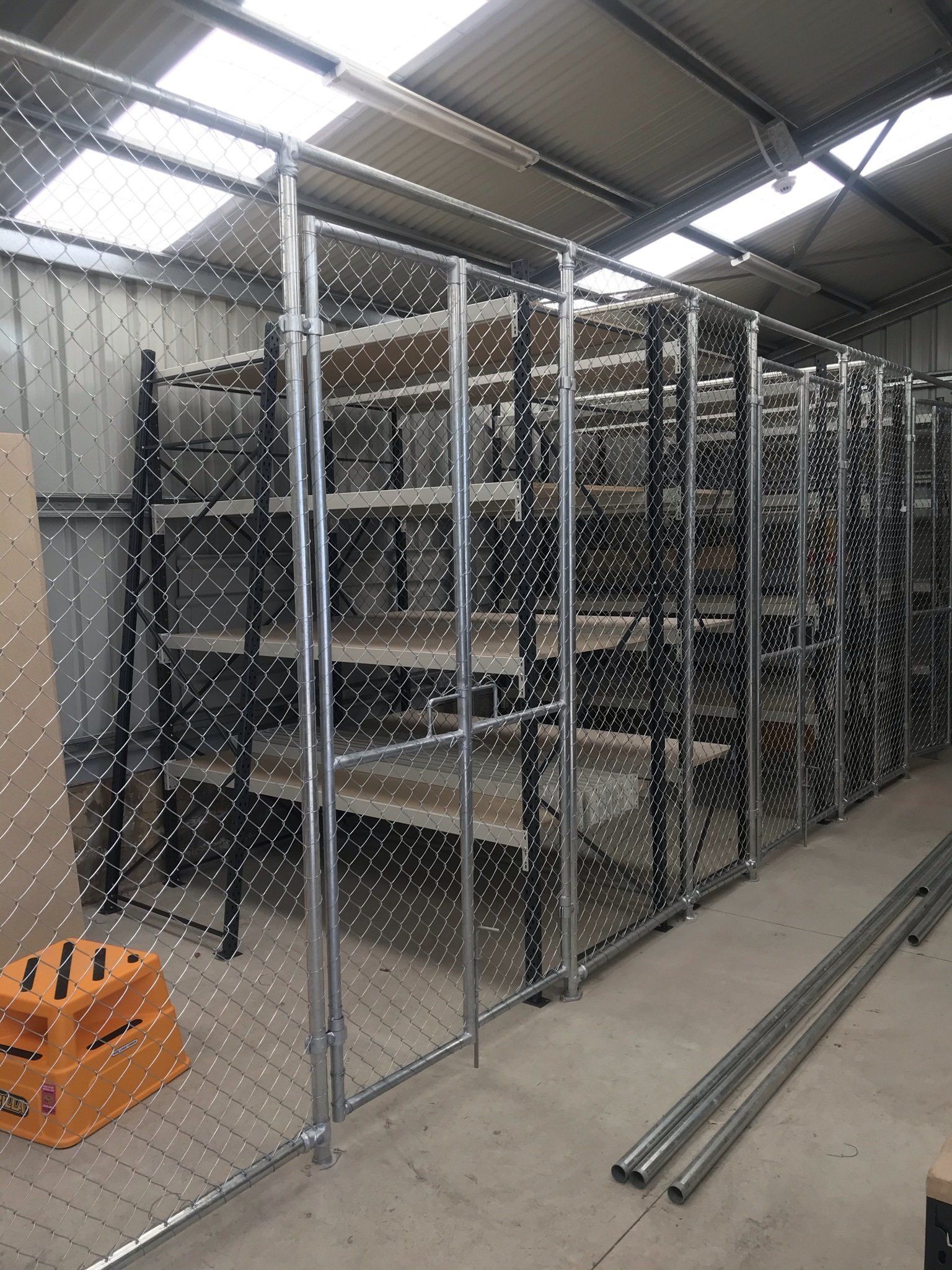 Chain mesh storage cages in a sports shed