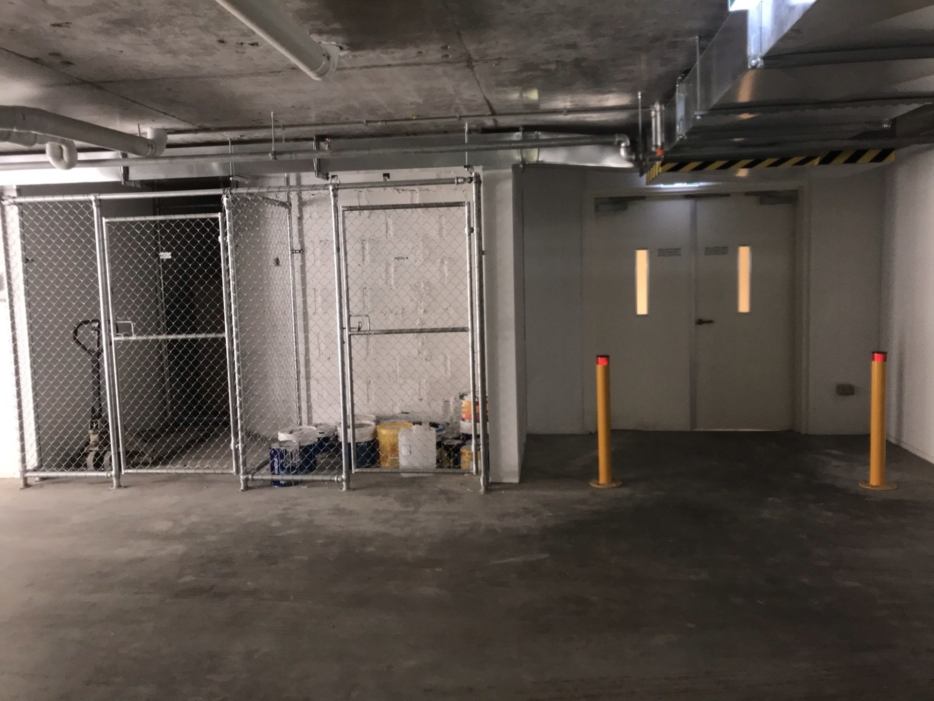 Chain mesh storage cages in a basement
