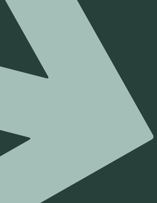 Close-up of a pale green arrow icon on a dark green background