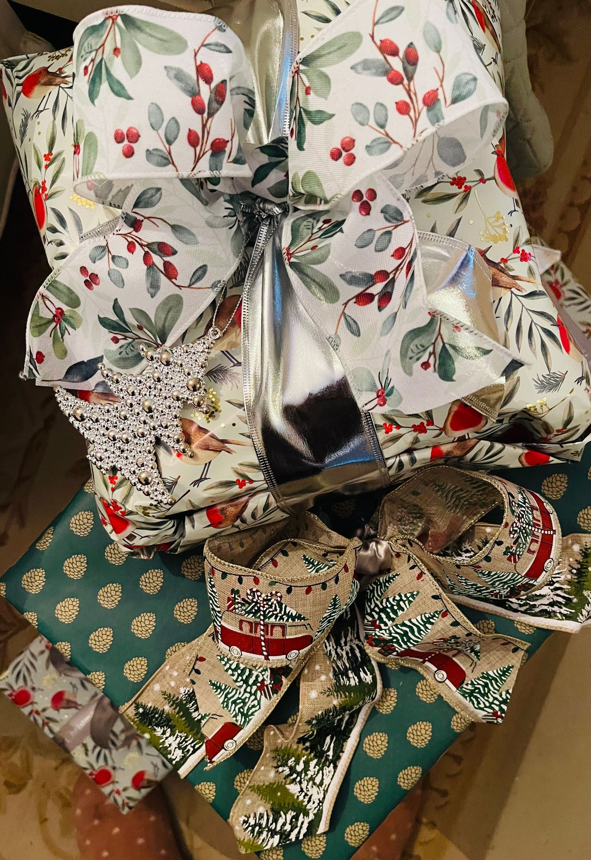 Wrapped Christmas gifts with decorative bows.