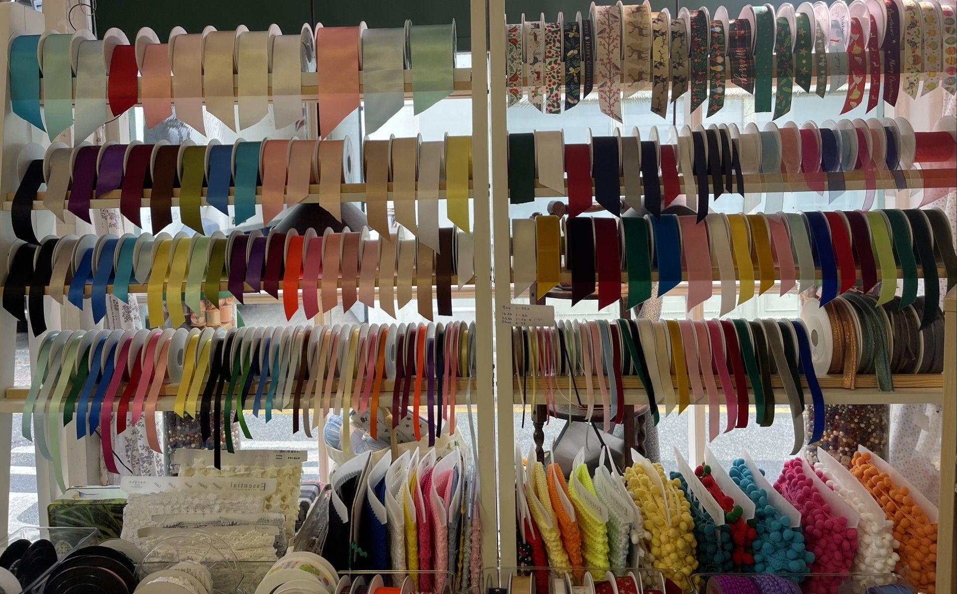 Shelves displaying a wide array of colorful ribbons