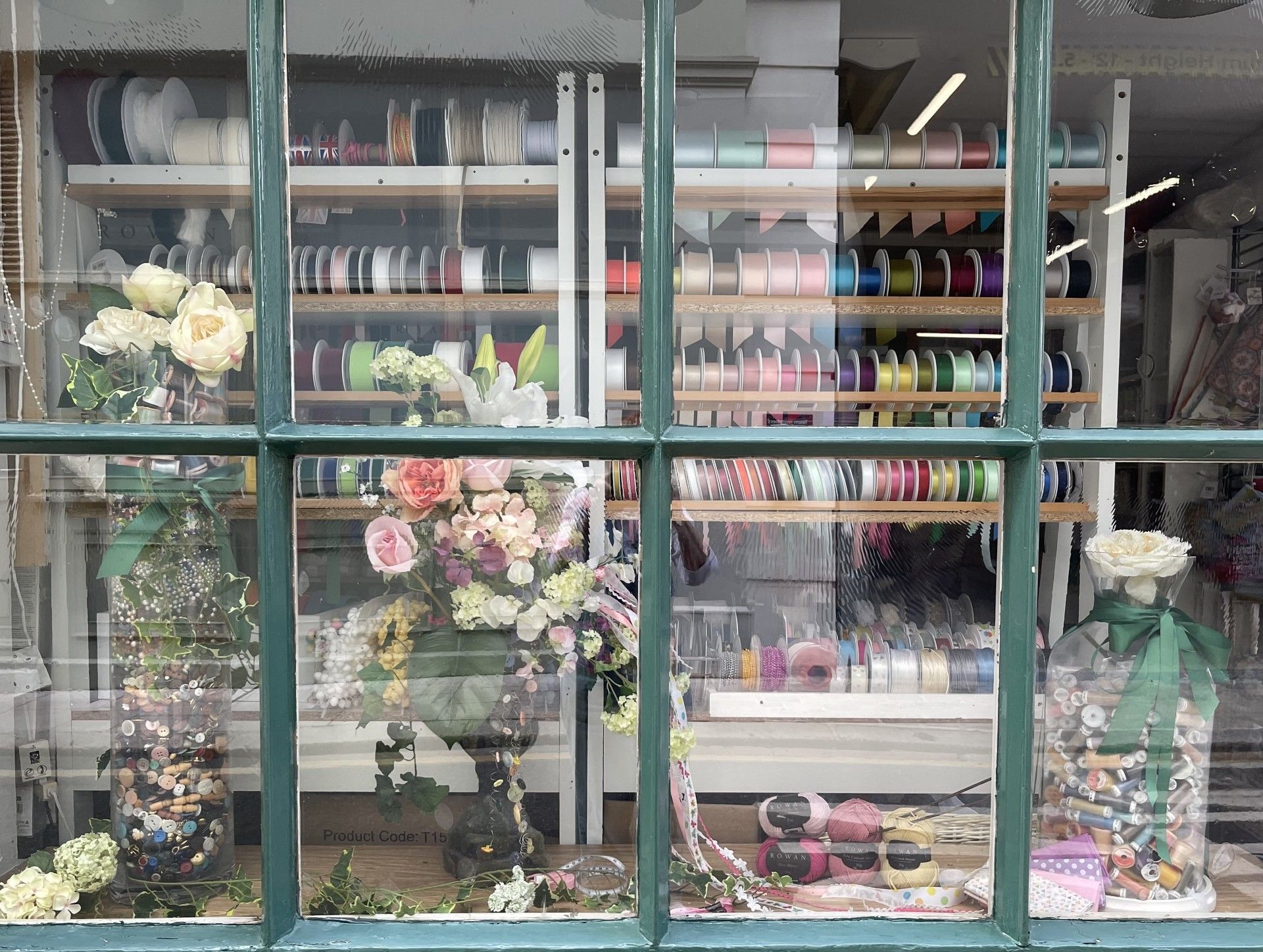 A window with a lot of flowers in it