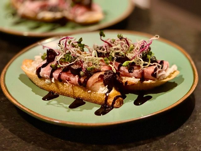 Goat cheese, fig, and prosciutto crostini