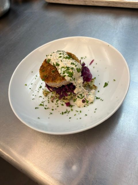 Pork Schnitzel with braised red cabbage, herbed spaetzel, and a mustard cream sauce